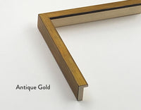 A modern picture frame in an antique gold colour for Butler Gallery’s fine art prints. A close up of one corner, cut off from the rest of the frame showing the depth and width of the frame.