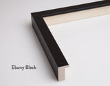 A modern picture frame in an ebony black colour for Butler Gallery’s fine art prints. A close up of one corner, cut off from the rest of the frame showing the depth and width of the frame.