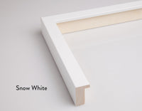 A modern picture frame in a snow white colour for Butler Gallery’s fine art prints. A close up of one corner, cut off from the rest of the frame showing the depth and width of the frame.